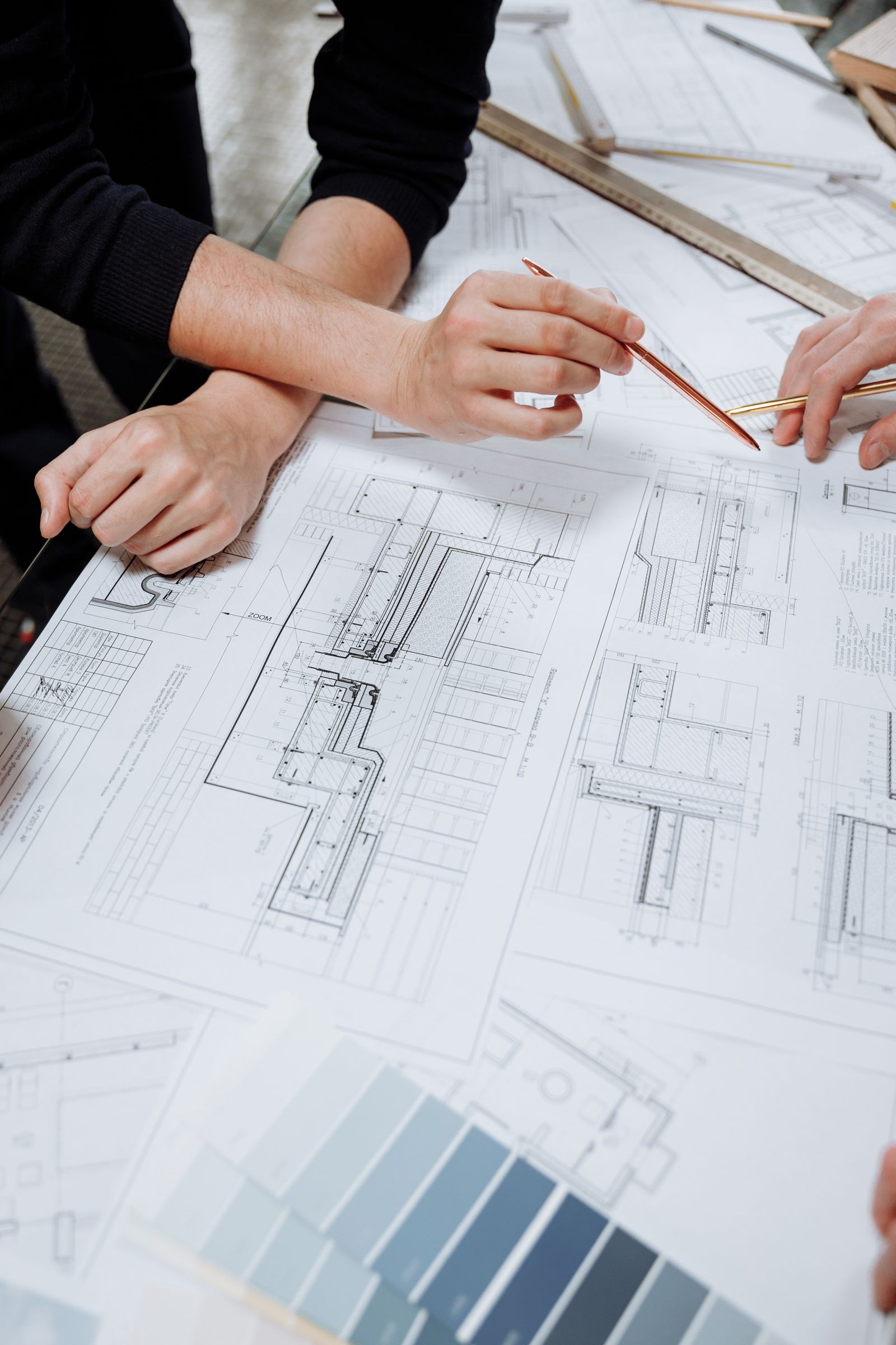 Designers reviewing house plans together