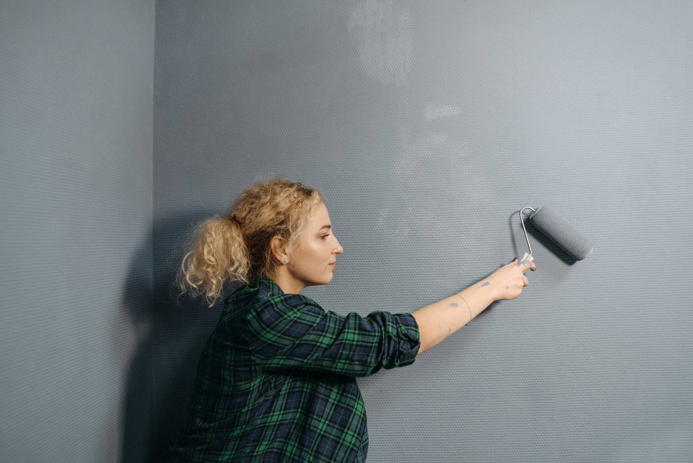 Interior wall being repainted with a roller
